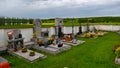 Graves on the small Czech rural cemetery decorated with flowers