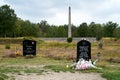 Gravestone of Anne Frank and Obelisc at Bergen-Belsen memorial