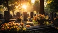 Gravestones and flowers in the cemetery at sunset. Concept of funeral