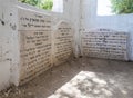 The gravestones with words of gratitude in Hebrew inside the reconstructed tomb Rabbi Nakhman Katufa near the kibbutz Baram in Wes