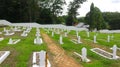 graveyard with white cement walls and green grass for the dead Royalty Free Stock Photo