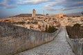 Gravina in Puglia, Bari, Italy: landscape at sunrise from the ancient aqueduct bridge of the old rock church and the cave houses Royalty Free Stock Photo