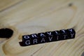 Gravity written on wooden blocks. Inspiration and motivation concepts. Royalty Free Stock Photo