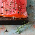 Gravlax, scandinavian beet cured spiced salmon on the board, top view, salted red fish