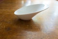Gravy boat on wooden table Royalty Free Stock Photo
