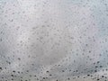 Gray abstract background with raindrops on glass Royalty Free Stock Photo