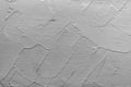 Gray abstract texture of surface covered with putty. Wood background covered with putty.