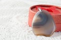 Gray agate pendant and red box Royalty Free Stock Photo