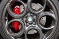 Gray alloy sports car wheel and disc brake close-up
