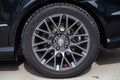 Gray alloy titanium disc in light alloy in modern sporty design of size 245 45 R17 with momo emblem on the black car