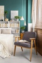 Gray armchair in bedroom Royalty Free Stock Photo