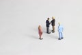 Gray Backgrond, Simple Illustration Photo for Mini Figure Two Man Toy Handshaking for Business Agreement Beyond their partner