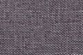 Gray background with braided checkered pattern, closeup. Texture of the weaving fabric, macro. Royalty Free Stock Photo