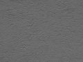 Gray background facade plaster . Monolithic plaster decorative backdrop. Single layer scraped cement plaster wallpaper. Silver ext Royalty Free Stock Photo