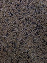 Gray background of many small stones in close-up. Abrasive surface. Royalty Free Stock Photo