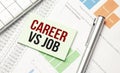 gray background notepad with text. CAREER VS JOB Royalty Free Stock Photo