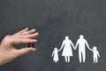 On a gray background Silhouette of a family, hands holding beans Royalty Free Stock Photo