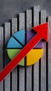 Gray bars and colorful pie chart with red arrow show positive financial performance Royalty Free Stock Photo