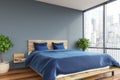 Gray bedroom, blue bed
