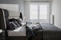 Gray bedroom with window blinds