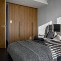 Gray bedroom with wooden closet