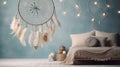 Gray beige dream catcher in bedroom interior on aquamarine textured background. Bedroom decor Royalty Free Stock Photo