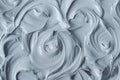 Gray bentonite facial clay (alginate mask, face cream, body wrap) texture close up, selective focus. Abstract background Royalty Free Stock Photo