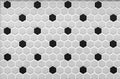 Gray-black ceramic mosaic tiles in the shape of honeycombs