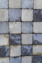 Gray black texture of square paving slabs grey black background of road tiles Royalty Free Stock Photo