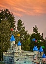 Castle trees sunset flags turrets