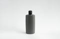 Gray bottle of shampoo, conditioner, hair rinse, mouthwash, on a white background. Royalty Free Stock Photo