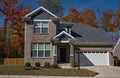 Gray Brick Contemporary Home with Side Wooden Fence Royalty Free Stock Photo