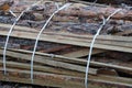 Gray brown wooden texture from a pile of pine boards