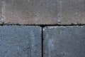 Gray building cinder blocks made of cement stacked close-up background. Lot of large concrete bricks stacking texture Royalty Free Stock Photo