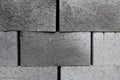 Gray building cinder blocks made of cement stacked close-up background. Royalty Free Stock Photo