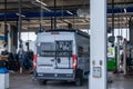 Gray camper van in a modern garage for a service on the engine