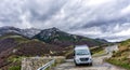 Gray camper van parked in the heart ofthe Picos de Europa in Spain Royalty Free Stock Photo