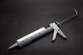Gray caulk gun Royalty Free Stock Photo