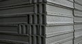 Gray cement blocks stacked in a neat pile. Each block features three vertical Royalty Free Stock Photo