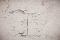 Gray cement wall with traces of the brush on the crumbling plaster. textural composition