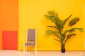 gray chair decorative flower on yellow background interior furniture minimalism Royalty Free Stock Photo