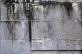 Gray cinder block concrete wall with black mildew stains background texture Royalty Free Stock Photo