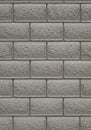 Gray cinder block wall featuring a consistent pattern of evenly stacked rectangular Royalty Free Stock Photo