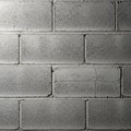 Gray cinder block wall with a rough, textured surface. Blocks are rectangular and Royalty Free Stock Photo