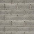 Gray cinder block wall with a uniform pattern and coarse texture. Blocks are rectangula Royalty Free Stock Photo