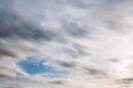 Gray cloudy sky with blue skylight. Background. Space for text