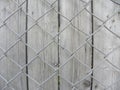 Wire mesh fence with wood background Royalty Free Stock Photo