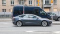 Gray color Tesla Model 3 car on street. The Tesla car is All-electric four-door fastback Royalty Free Stock Photo