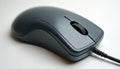 Gray computer mouse with scroll wheel and wire. Classic computer accessory for navigation. Modern or retro tech input device for Royalty Free Stock Photo