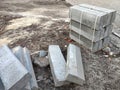 Gray concrete blocks scattered on the ground to start construction